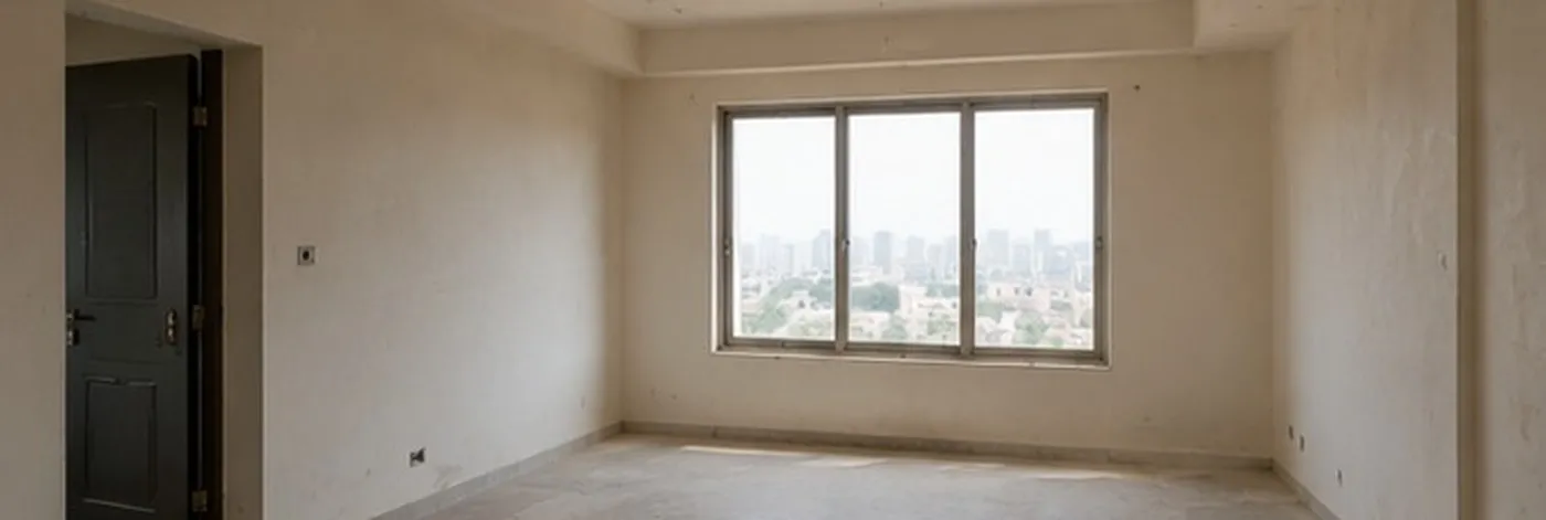 Bare bedroom shell with unfinished walls and an uncovered floor